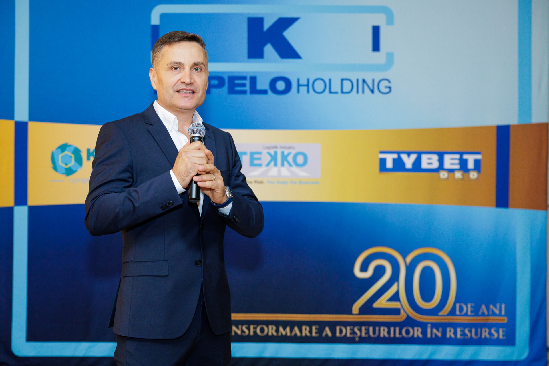 Adrian Iancu, CEO & Founder of KUPELO Holding, speaking at the 20th anniversary event